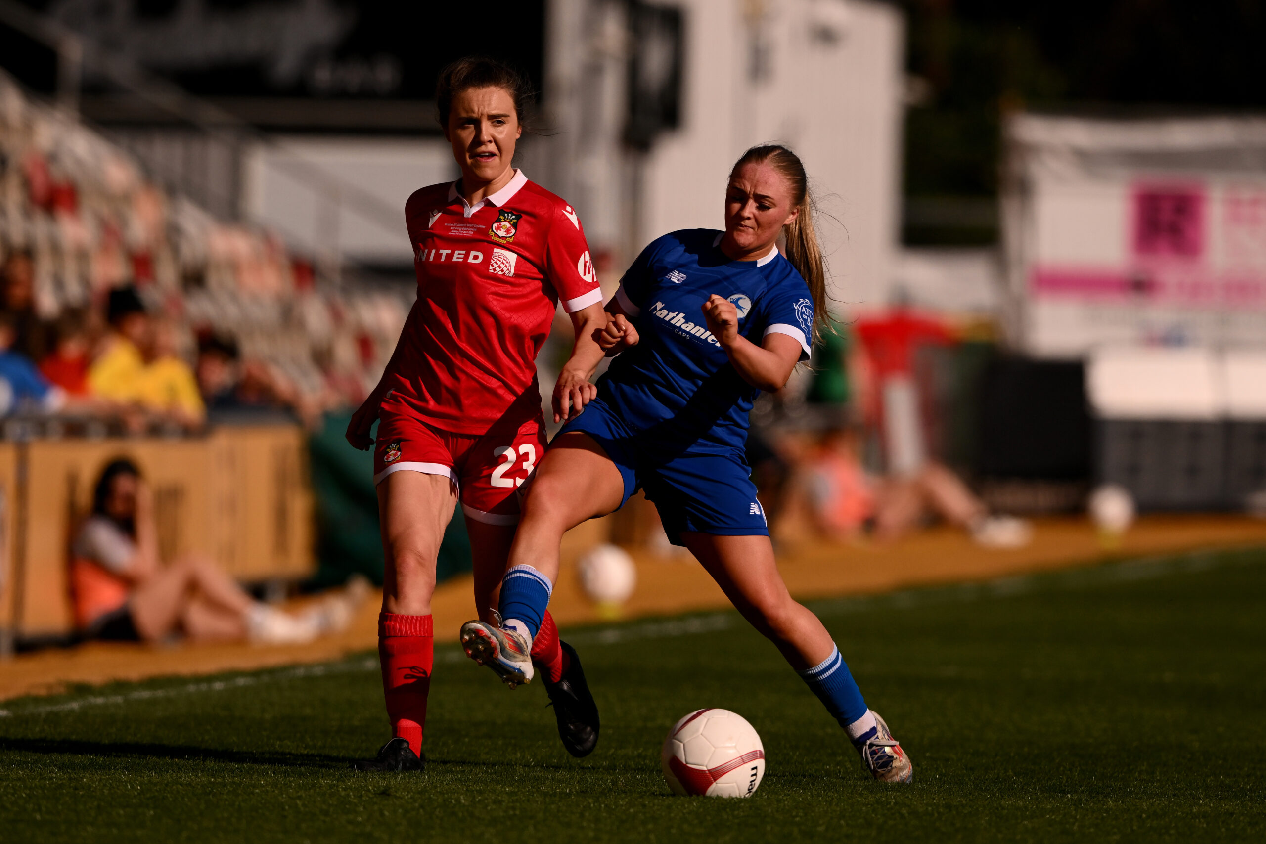 Wrexham AFC Women's Mari Gibbard under pressure from Cardiff City Women's Lily Billingham during the 2024/25 Bute Energy Welsh Cup Final fixture between Wrexham AFC Women & Cardiff City Women FC at Rodney Parade, Newport, Wales